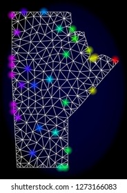Mesh vector map of Manitoba Province with glare effect. Light spots have bright rainbow colors. Abstract lines, triangles, light spots and points on a dark background with map of Manitoba Province.