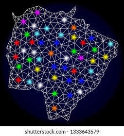 Mesh vector map of Mato Grosso do Sul State with glare effect on a dark background. Abstract lines, triangles, light colorful spots and points forms map of Mato Grosso do Sul State.