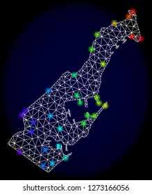 Mesh vector map of Monaco with glare effect. Light spots have bright rainbow colors. Abstract lines, triangles, light spots and points on a dark background with map of Monaco.