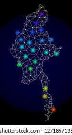 Mesh vector map of Myanmar with glare effect. Light spots have bright spectrum colors. Abstract lines, triangles, light spots and points on a dark background with map of Myanmar.