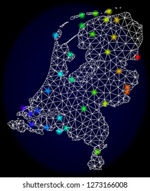 Mesh vector map of Netherlands with glare effect. Light spots have bright spectrum colors. Abstract lines, triangles, light spots and points on a dark background with map of Netherlands.