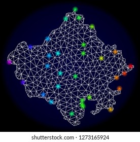 Mesh vector map of Rajasthan State with glare effect. Light spots have bright spectrum colors. Abstract lines, triangles, light spots and points on a dark background with map of Rajasthan State.