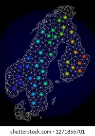 Mesh vector map of Scandinavia with glare effect. Light spots have bright spectrum colors. Abstract lines, triangles, light spots and points on a dark background with map of Scandinavia.