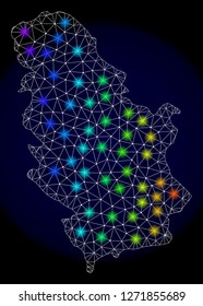 Mesh vector map of Serbia with glare effect. Light spots have bright spectrum colors. Abstract lines, triangles, light spots and points on a dark background with map of Serbia.
