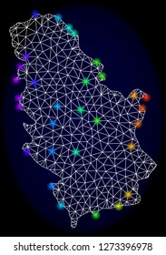 Mesh vector map of Serbia with glare effect. Light spots have bright spectrum colors. Abstract lines, triangles, light spots and points on a dark background with map of Serbia.
