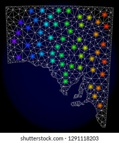 Mesh vector map of South Australia with glare effect on a dark background. Light spots have bright rainbow colors. Abstract lines, triangles, light spots and points forms map of South Australia.