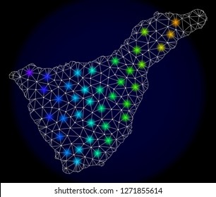 Mesh vector map of Tenerife with glare effect. Light spots have bright spectrum colors. Abstract lines, triangles, light spots and points on a dark background with map of Tenerife.