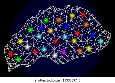 Mesh vector map of Wrangel Island with glare effect on a dark background. Abstract lines, triangles, light colorful spots and points forms map of Wrangel Island.
