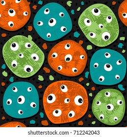 messy seasonal halloween seamless pattern with green orange turquoise monster cookies with eyes on dark background