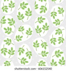messy white eggs with green leaf motif, vector Easter seamless pattern on light dotted background
