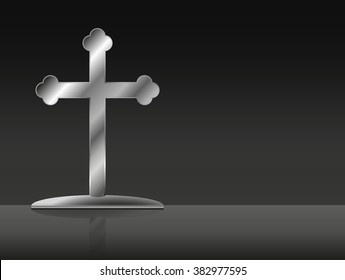 Metal cross on black background