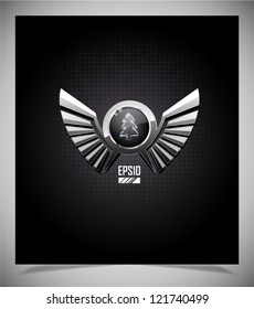 Metal emblem with wings on dark background