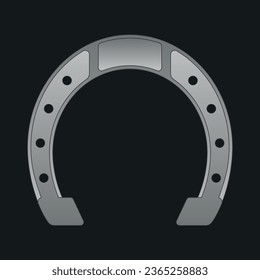 Metal silver horseshoe for good luck on a dark background