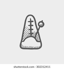 Metronome sketch icon for web and mobile. Hand drawn vector dark grey icon on light grey background.