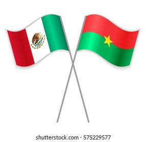 Mexican and Burkinabe crossed flags. Mexico combined with Burkina Faso isolated on white. Language learning, international business or travel concept.