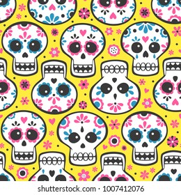 Mexican calavera day of the dead skulls with blue and pink decorations pattern on yellow background