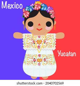 Mexican doll in traditional embroidered dress from Merida, Yucatan