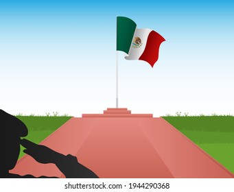 The Mexican flag flew above the pole in the shadow of a soldier saluting the flag