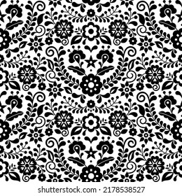 Mexican folk art vector seamless pattern with black and white flowers, textile or fabric print design inspired by traditional embroidery ornaments from Mexico.  
Nature colorful and vibrant wallpaper