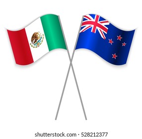 Mexican and New Zealand crossed flags. Mexico combined with New Zealand isolated on white. Language learning, international business or travel concept.