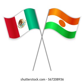 Mexican and Nigerien crossed flags. Mexico combined with Niger isolated on white. Language learning, international business or travel concept.