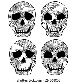 Mexican set of 4 sugar skulls for day of the dead . Hand drawn black isolate line art