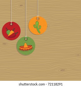 mexican style hanging tags on wood background