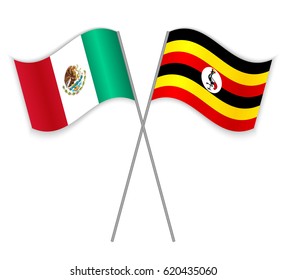 Mexican and Ugandan crossed flags. Mexico combined with Uganda isolated on white. Language learning, international business or travel concept.