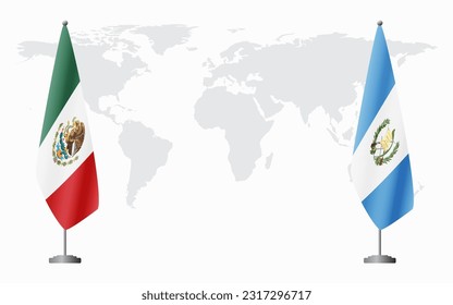 Mexico and Guatemala flags for official meeting against background of world map.