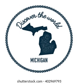 Michigan map in vintage discover the world rubber stamp. Hipster style nautical postage stamp, with round rope border. Vector illustration.