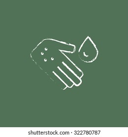 Microbes on the palm hand drawn in chalk on a blackboard vector white icon isolated on a green background.