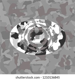 microchip, microprocessor icon inside grey camouflaged emblem