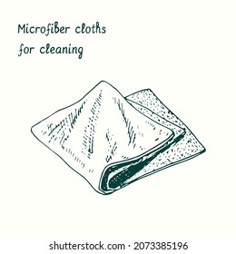 Microfiber cloths for cleaning. Ink black and white doodle drawing in woodcut style.