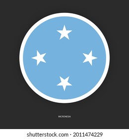 Bandera circular de Micronesia con borde blanco sobre fondo gris oscuro. Bandera del botón de Micronesia aislada en un fondo apenas oscuro.
