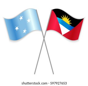 Micronesian and Antiguan crossed flags. Micronesia combined with Antigua and Barbuda isolated on white. Language learning, international business or travel concept.