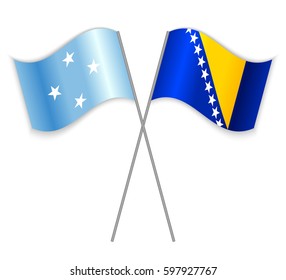 Micronesian and Bosnian crossed flags. Micronesia combined with Bosnia and Herzegovina isolated on white. Language learning, international business or travel concept.