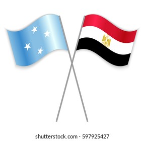 Micronesian and Egyptian crossed flags. Micronesia combined with Egypt isolated on white. Language learning, international business or travel concept.