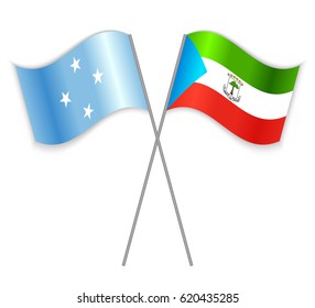Micronesian and Equatorial Guinean crossed flags. Micronesia combined with Equatorial Guinea isolated on white. Language learning, international business or travel concept.