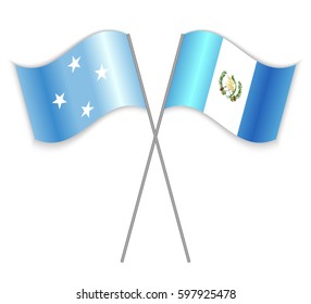 Micronesian and Guatemalan crossed flags. Micronesia combined with Guatemala isolated on white. Language learning, international business or travel concept.