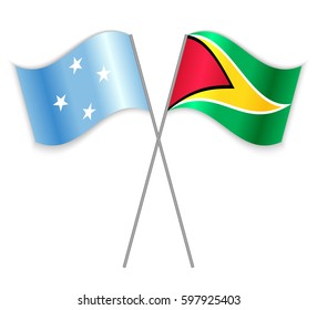 Micronesian and Guyanese crossed flags. Micronesia combined with Guyana isolated on white. Language learning, international business or travel concept.