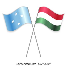Micronesian and Hungarian crossed flags. Micronesia combined with Hungary isolated on white. Language learning, international business or travel concept.