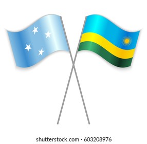 Micronesian and Rwandan crossed flags. Micronesia combined with Rwanda isolated on white. Language learning, international business or travel concept.