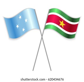 Micronesian and Surinamese crossed flags. Micronesia combined with Suriname isolated on white. Language learning, international business or travel concept.