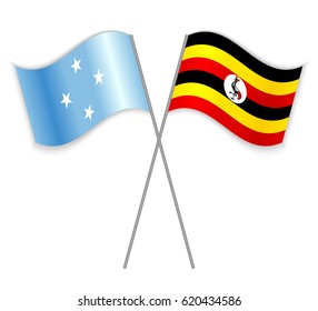 Micronesian and Ugandan crossed flags. Micronesia combined with Uganda isolated on white. Language learning, international business or travel concept.