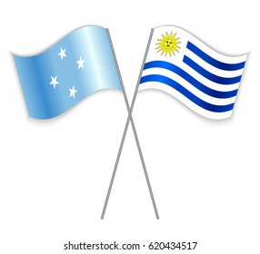 Micronesian and Uruguayan crossed flags. Micronesia combined with Uruguay isolated on white. Language learning, international business or travel concept.
