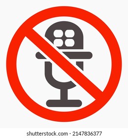 Microphone ban icon in red circle. No microphone. Silence sign. Vector icon.