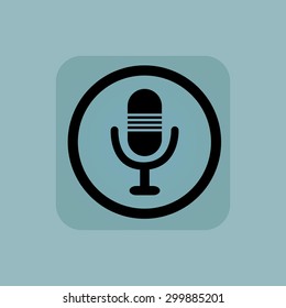 Microphone in circle, in square, on pale blue background