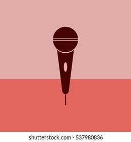The microphone in the classic flat style.Vector icon.
