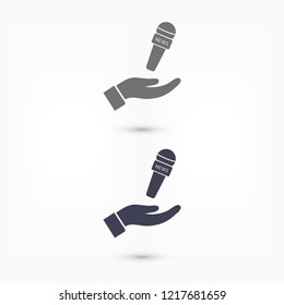 Microphone in hand icon