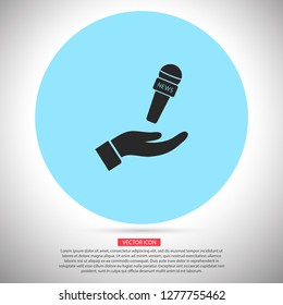 Microphone in hand icon